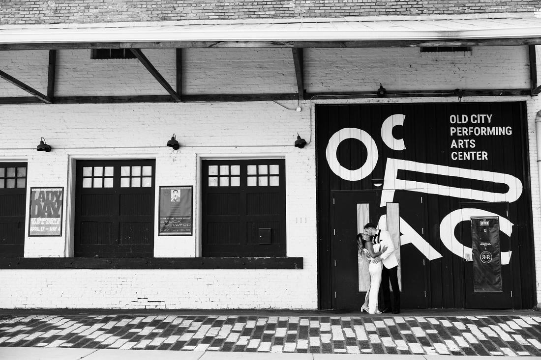 A couple kissing outside the Old City Performing Arts Center