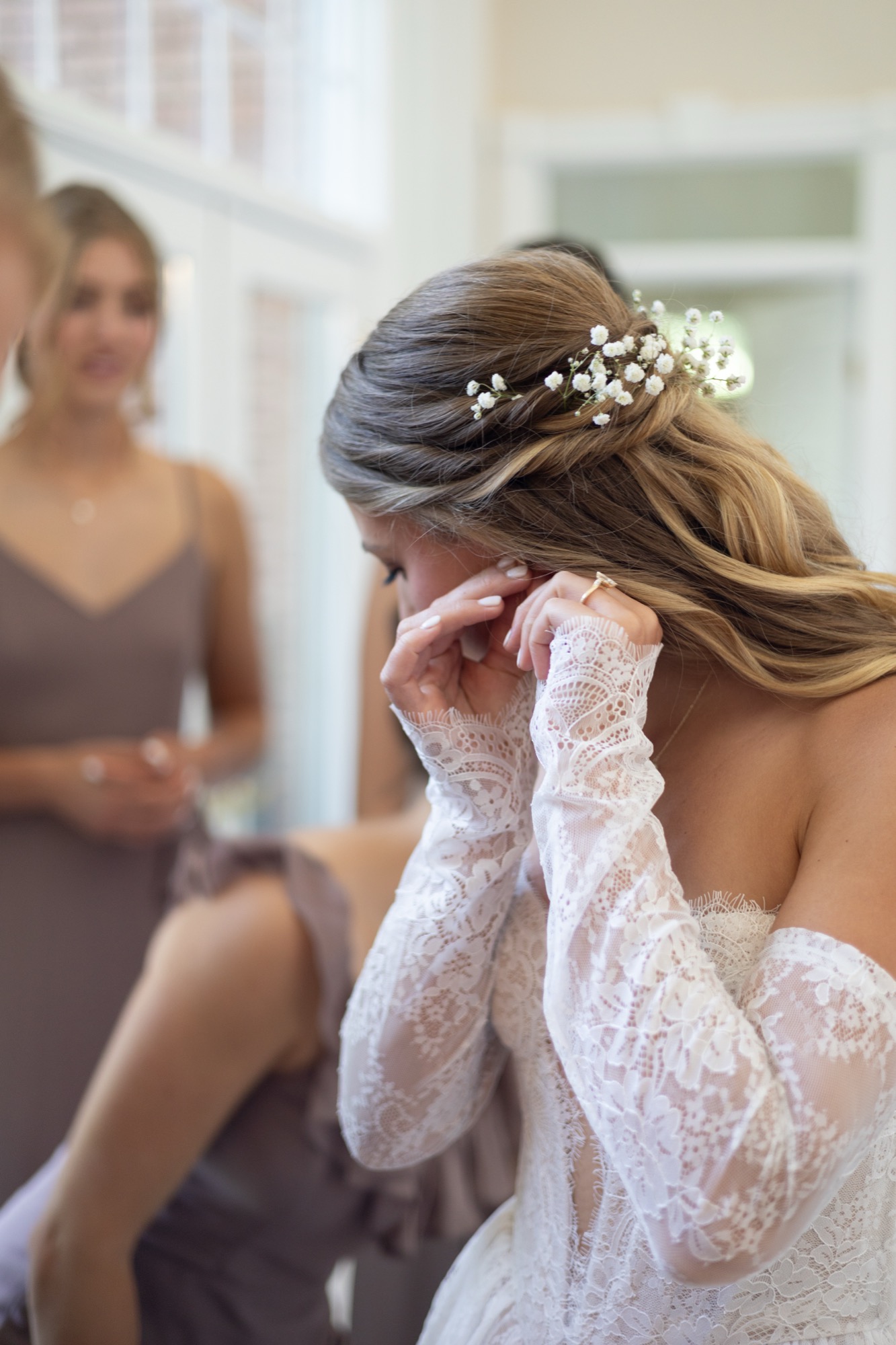 The bride wiping away a tear