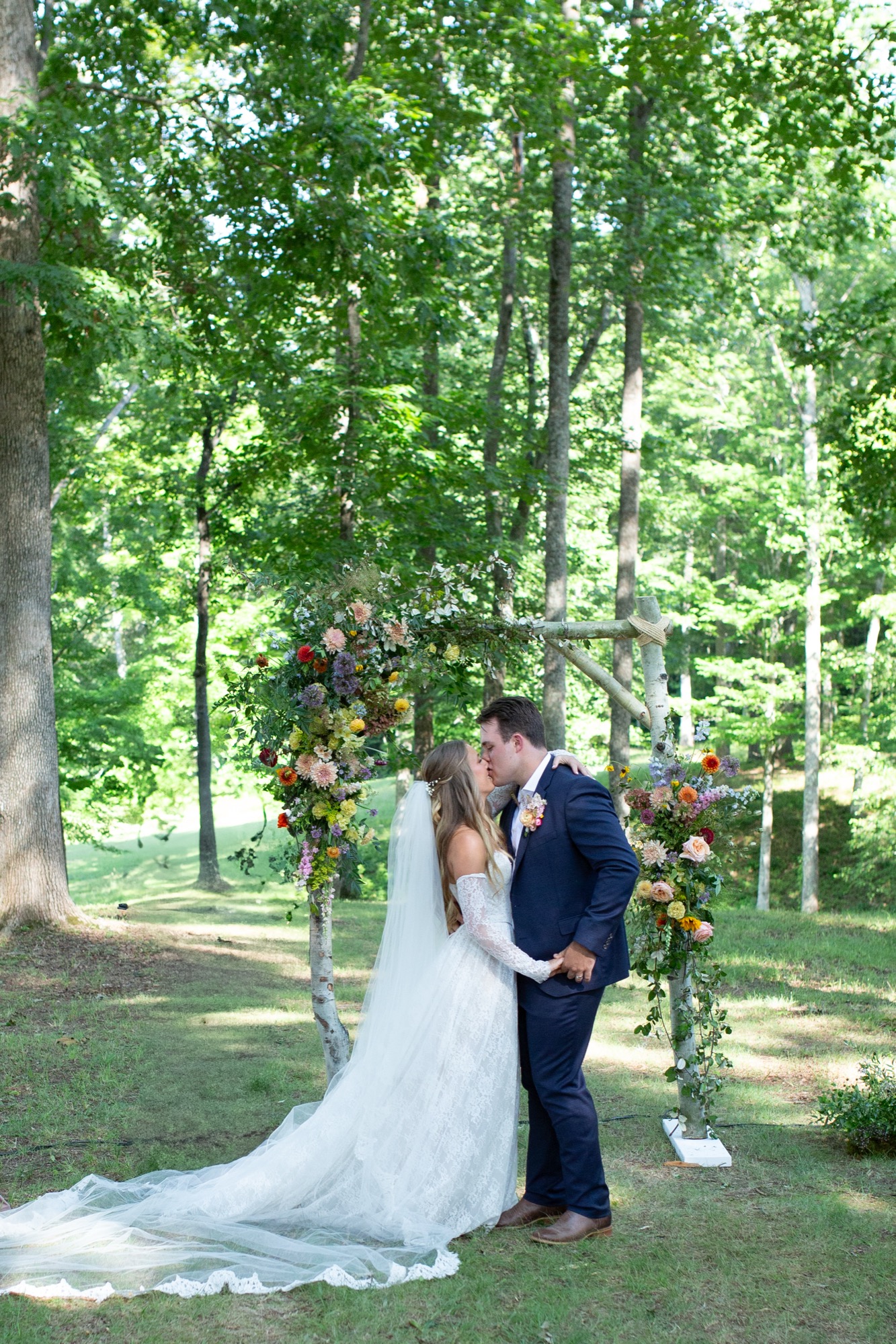 The couple at the flower arch