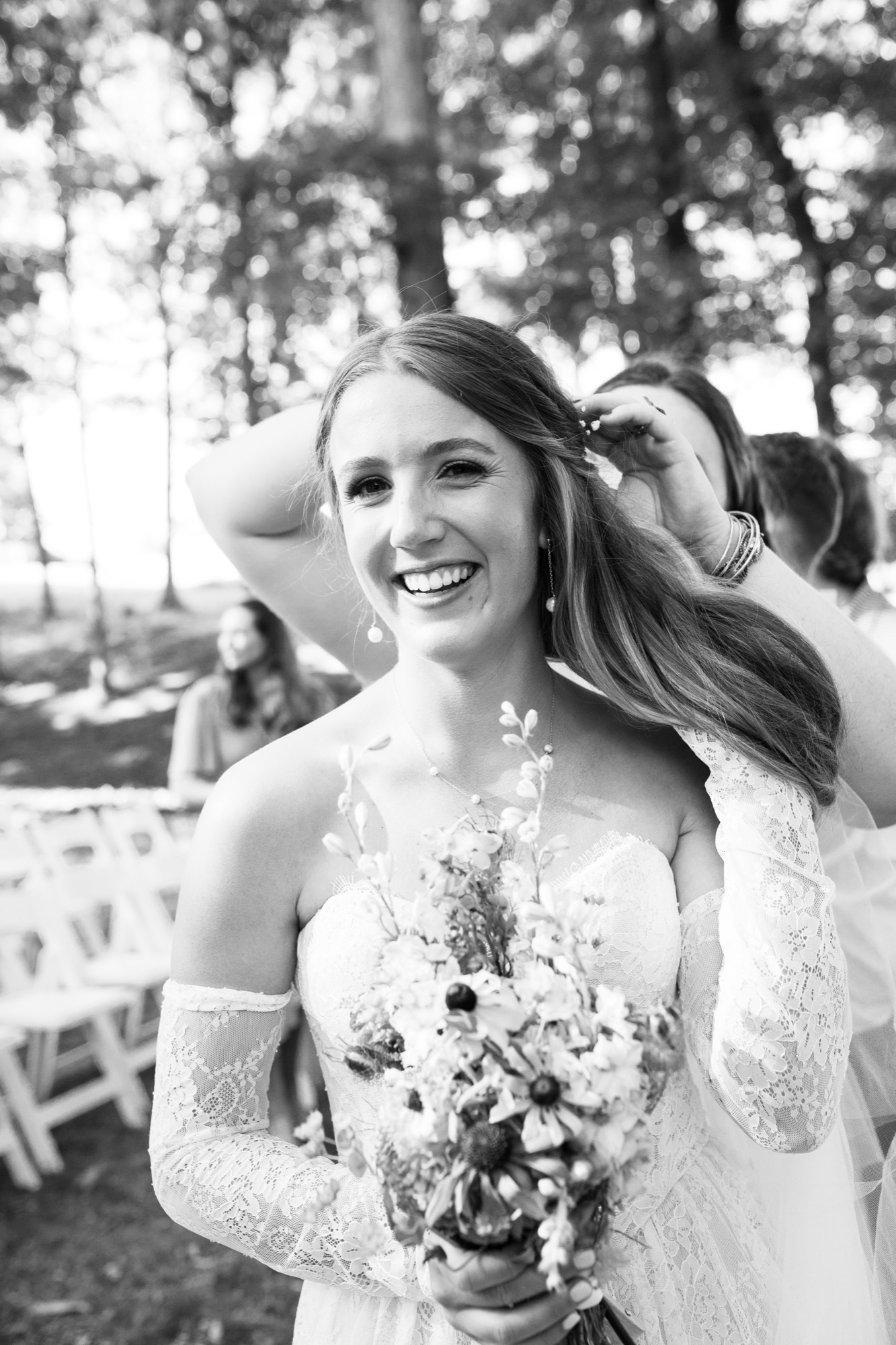 The bride laughing, in black and white