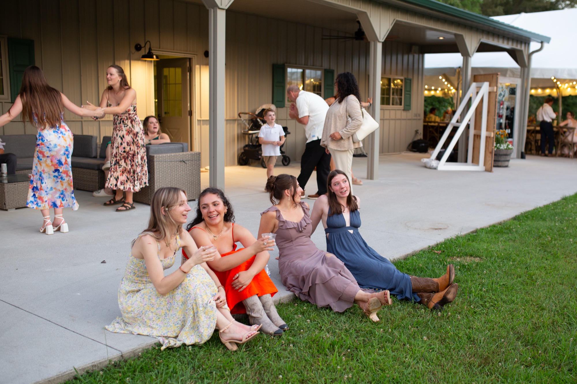 Guests lounging on the lawn by the porch