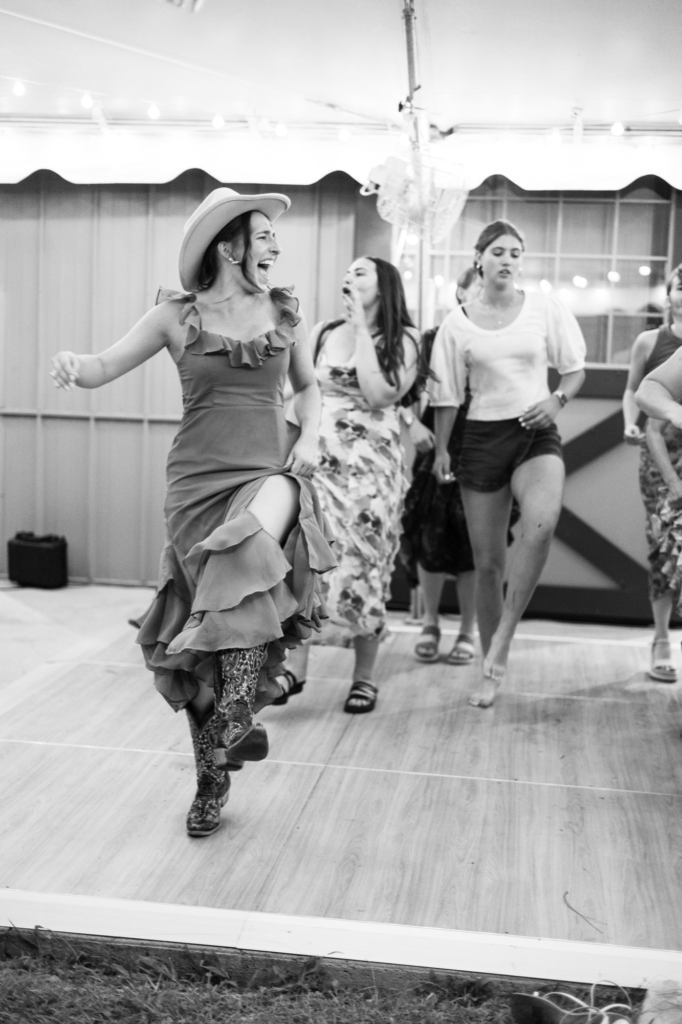 A guest dancing, in black and white