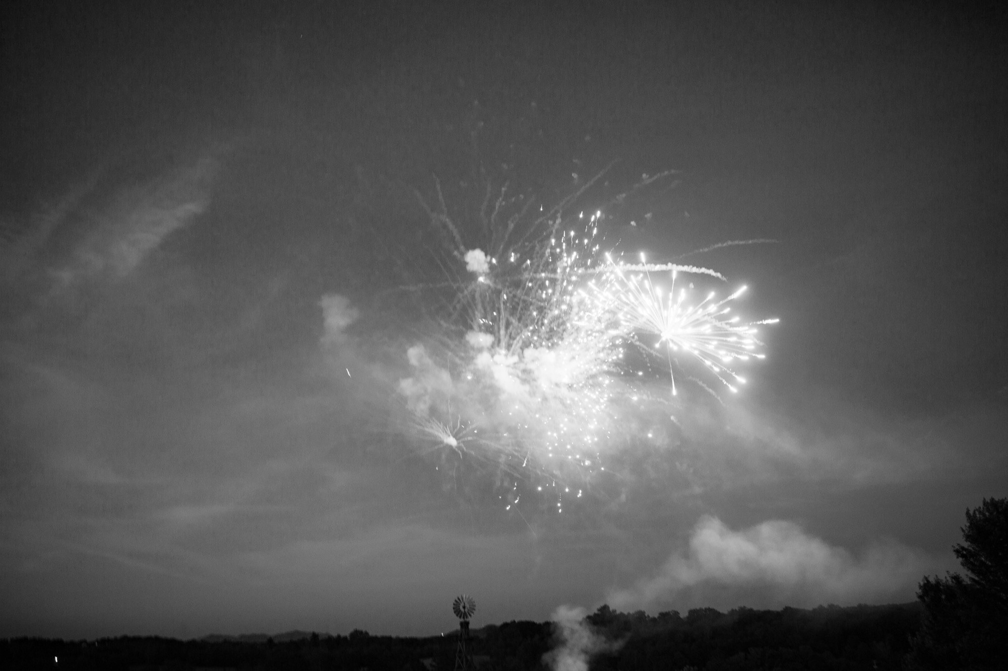 Fireworks over the field, in black and white