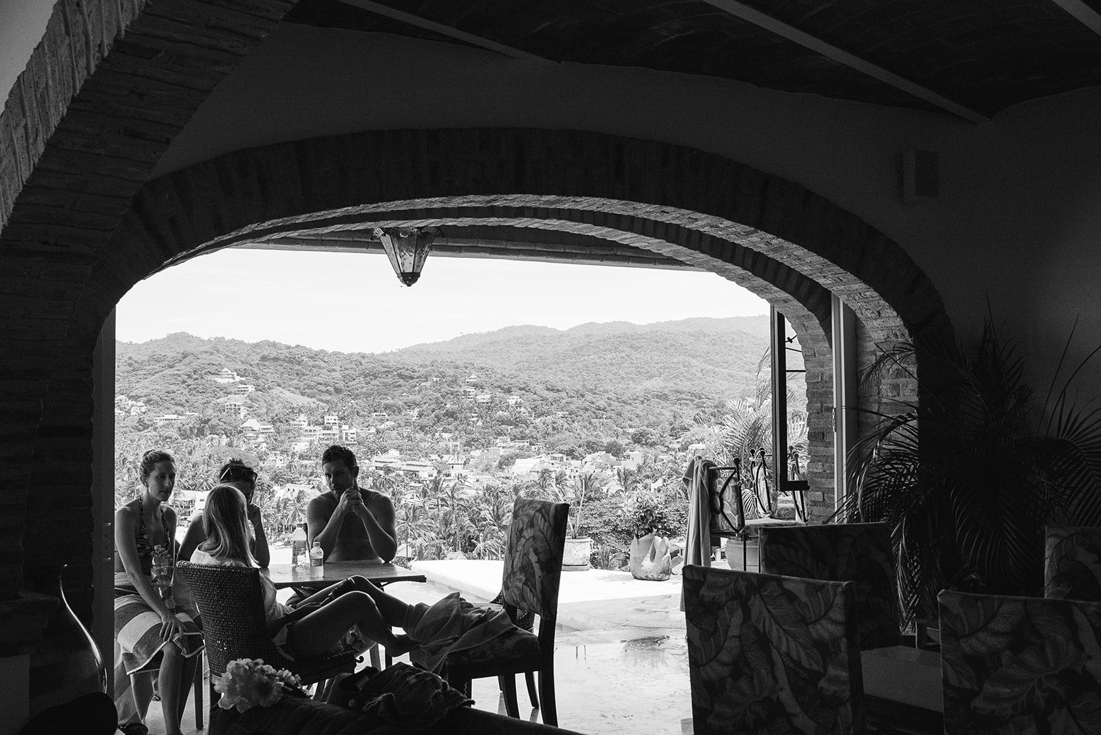 The view over Sayulita through an archway, in black and white
