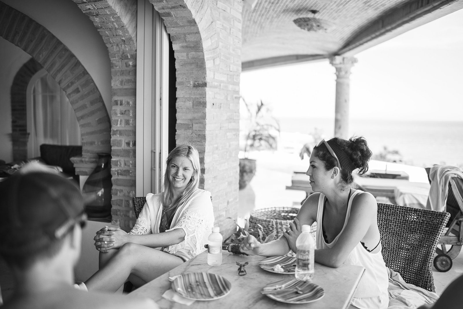 Friends at breakfast on the terrace, in black and white