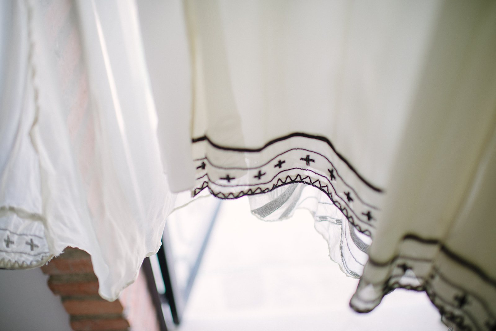 A curtain lifting in the breeze