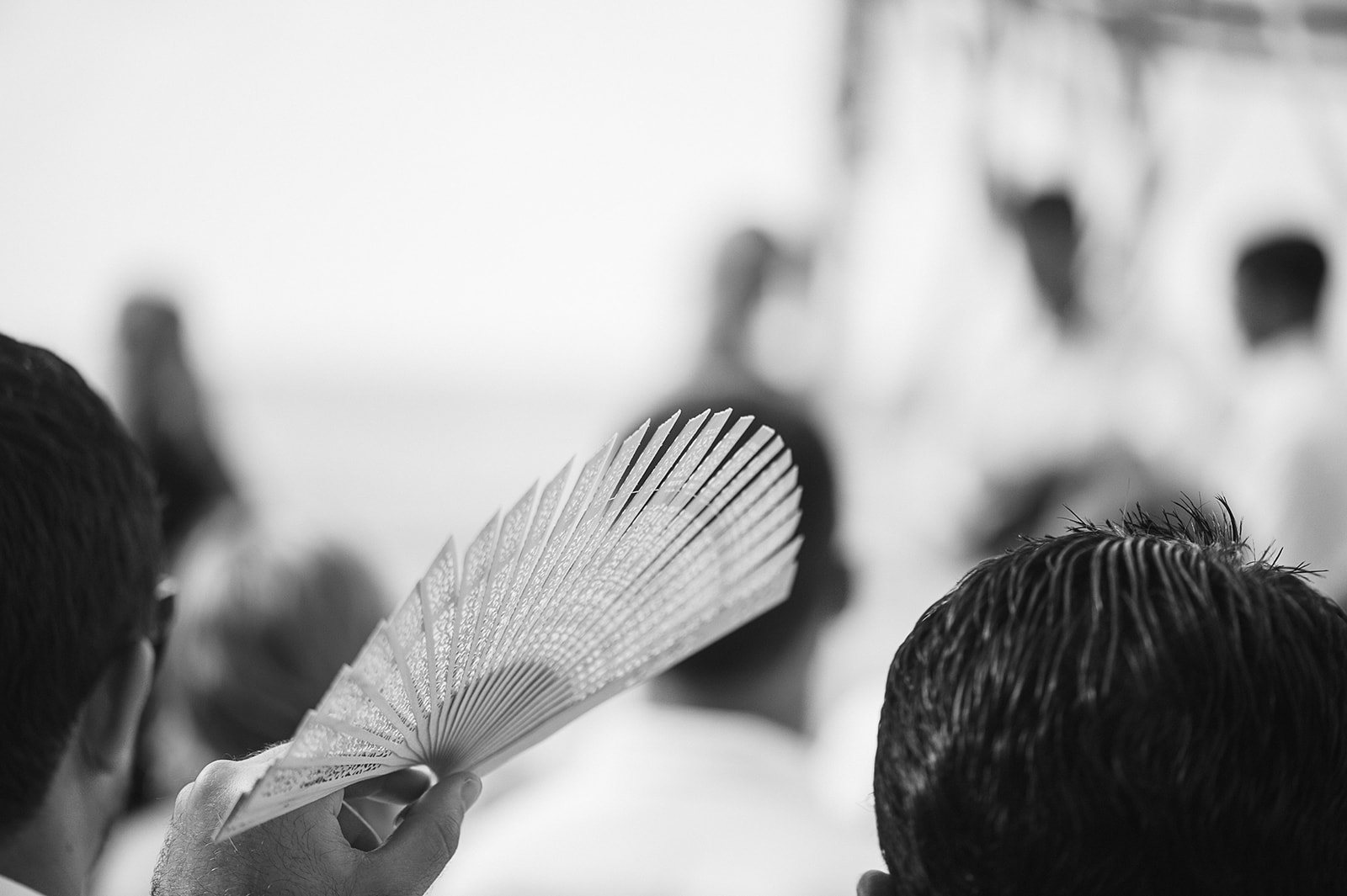 A guest with a fan, in black and white