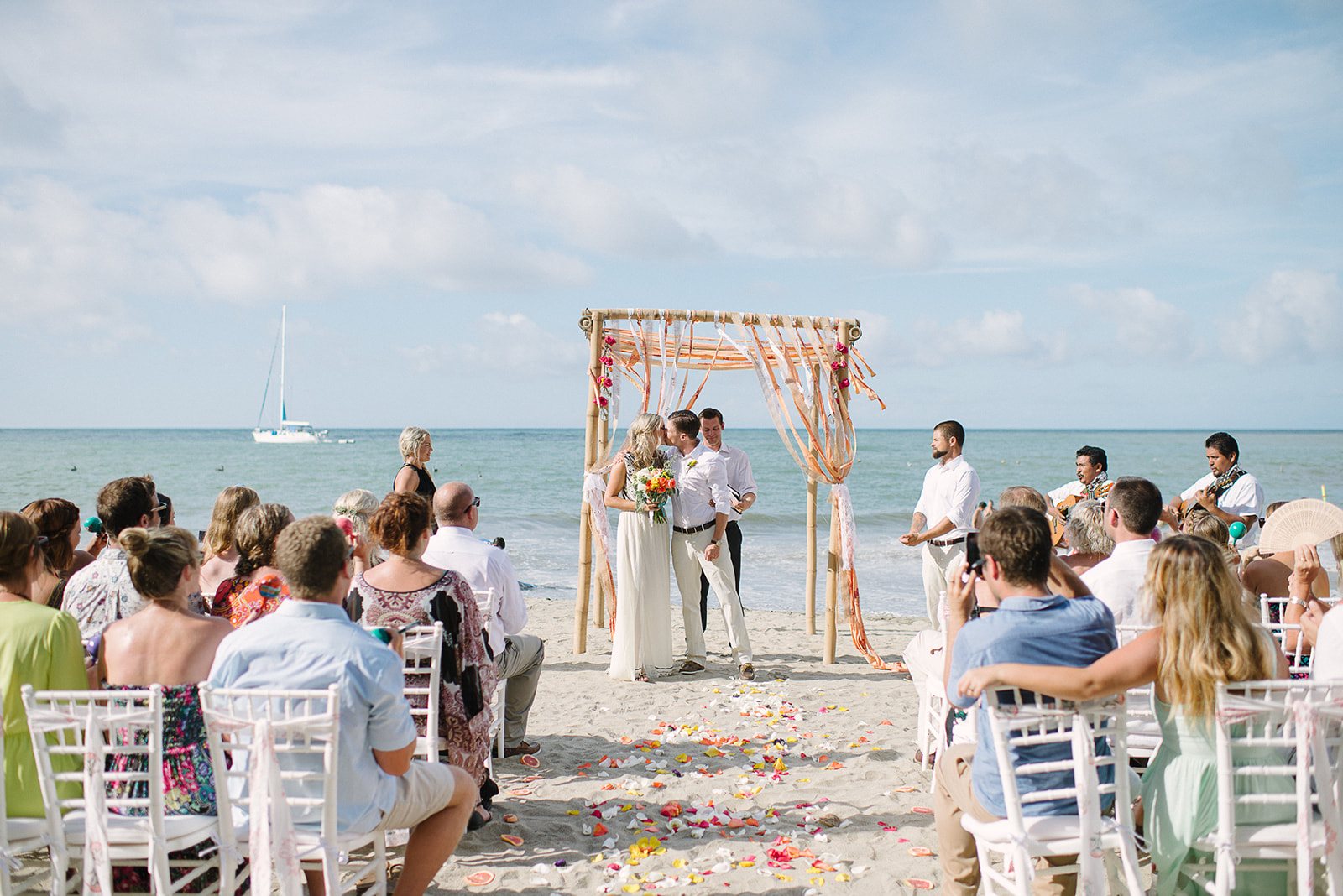 The beach ceremony under the arch