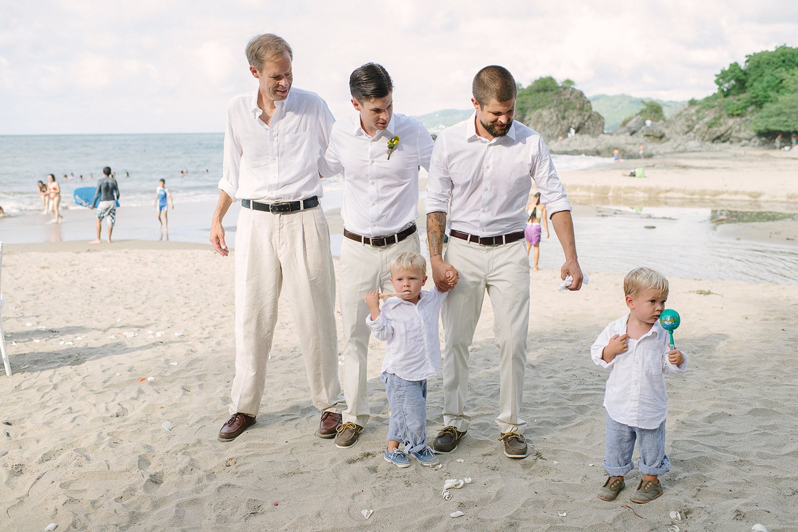 The groomsmen and the ring bearers on the beach
