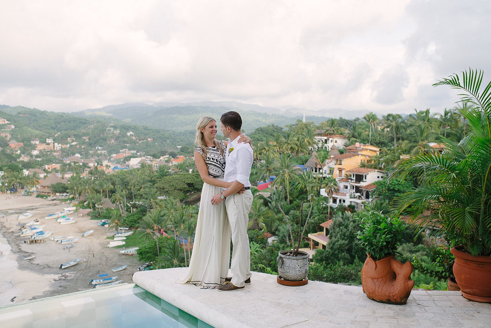 A couple on a terrace above the bay in Sayulita