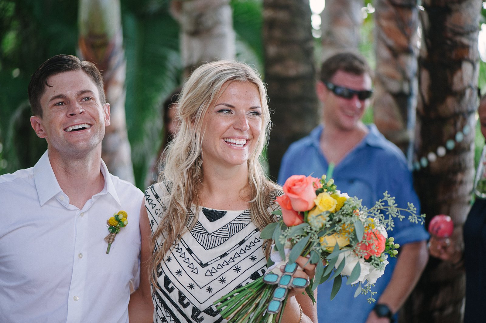 The couple laughing with friends
