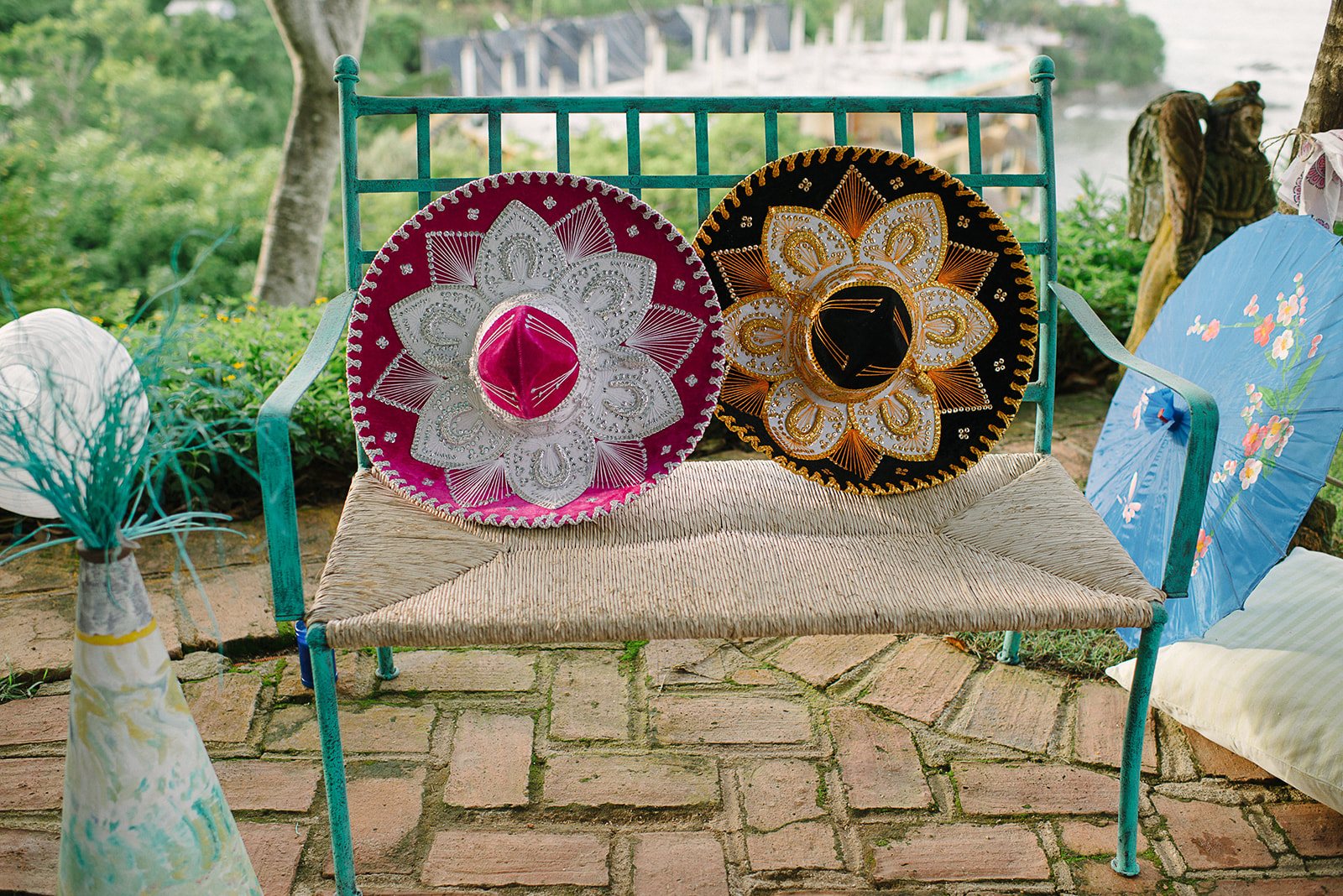 Painted sombreros on a bench