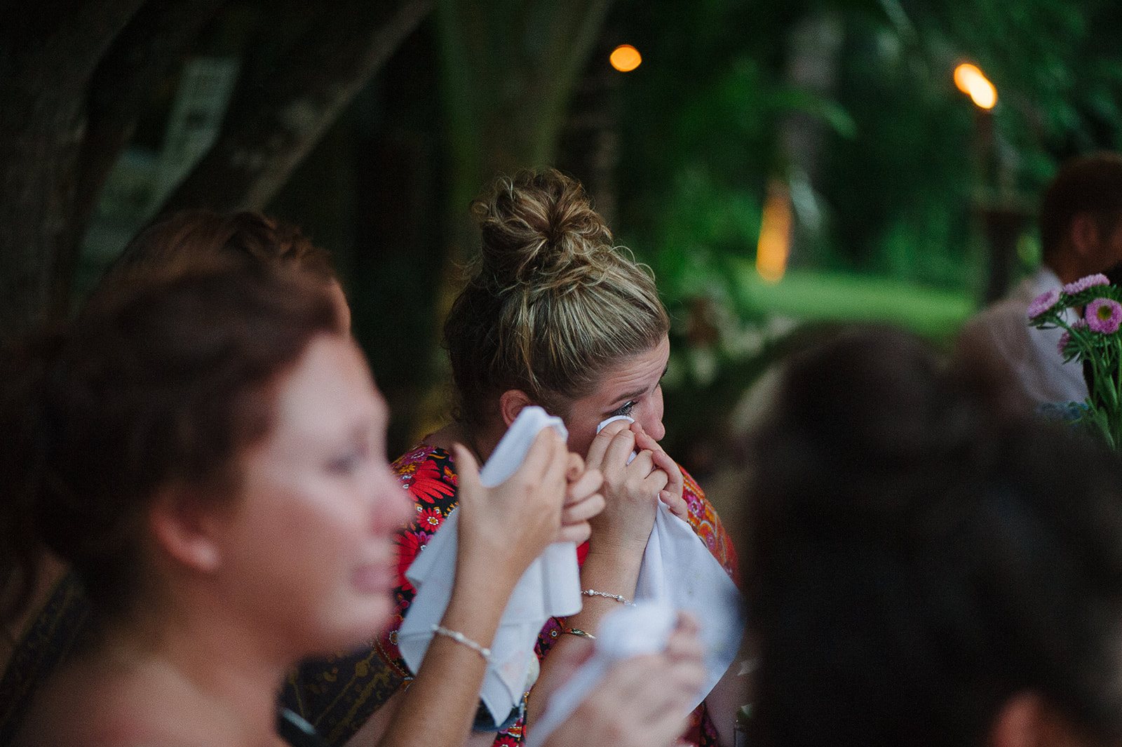 A guest laughing at dinner