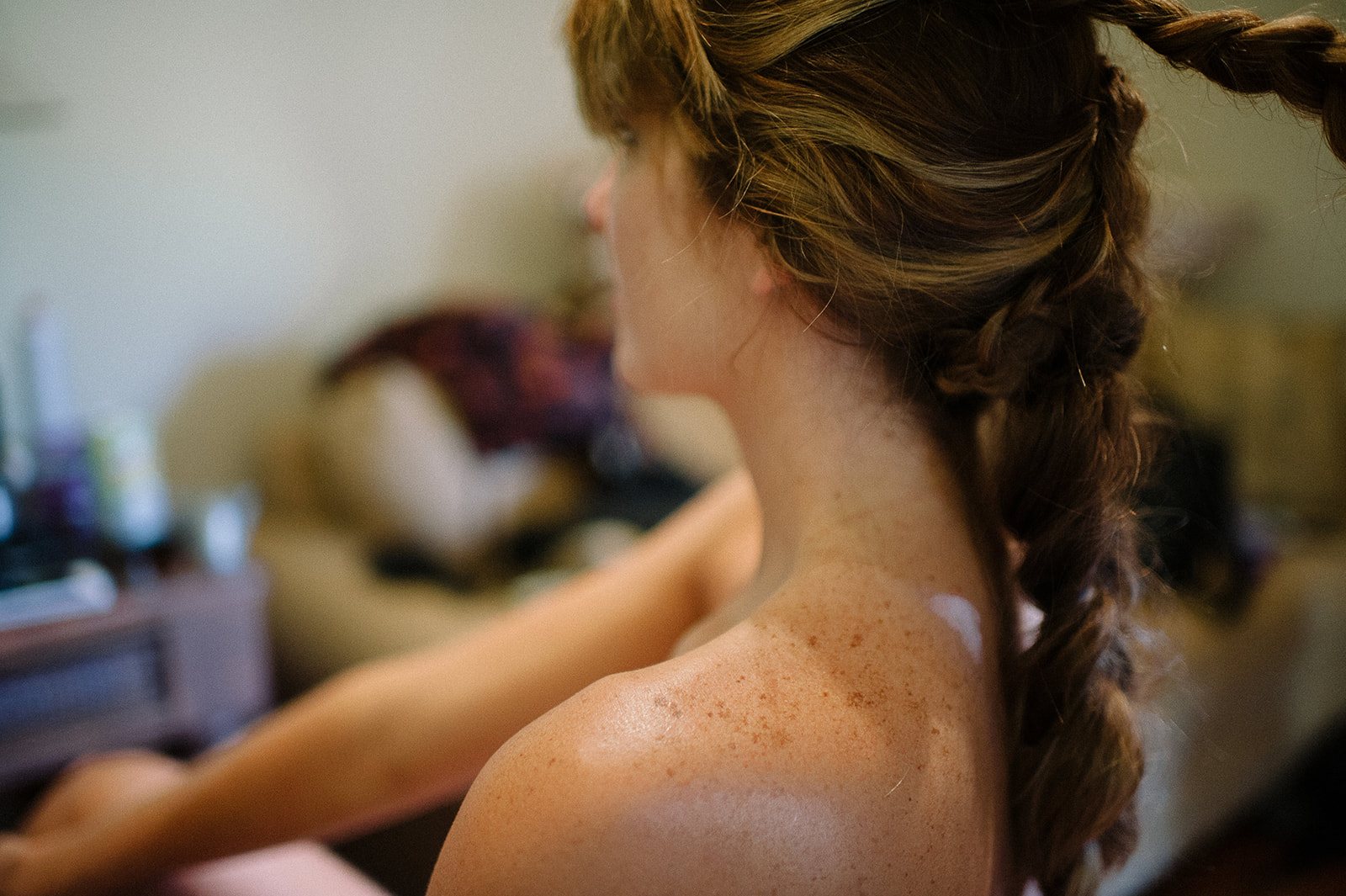The bride's braid, seen from behind as she gets ready