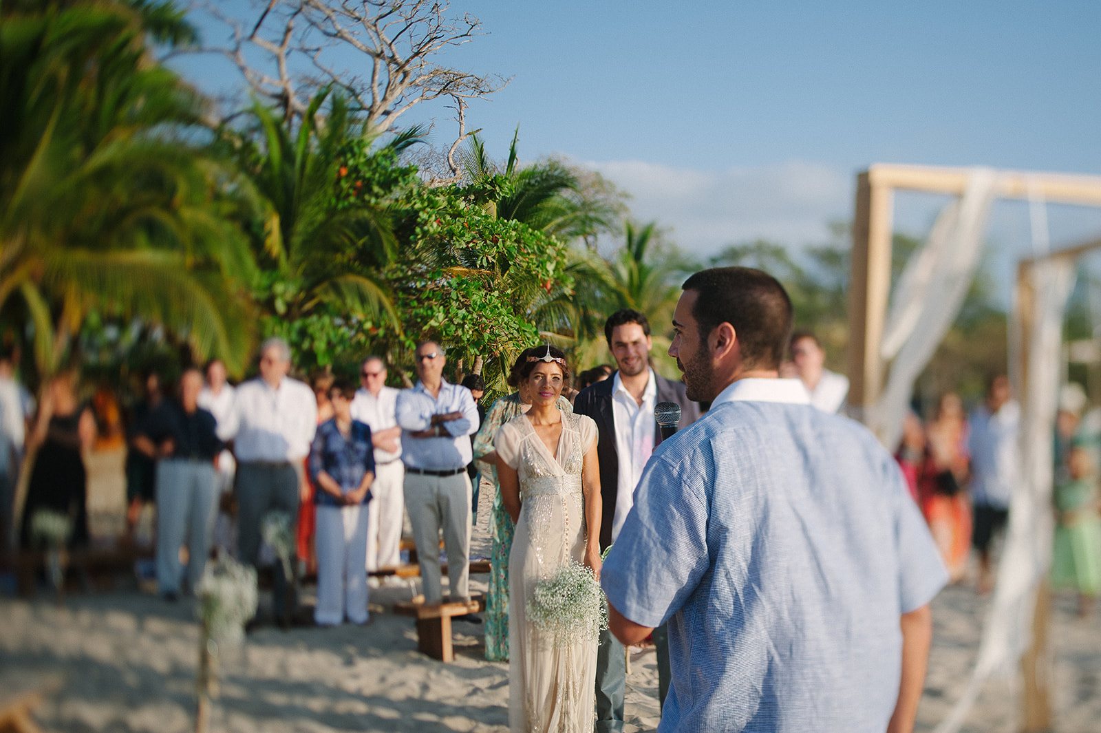 Guests gathering under the palms
