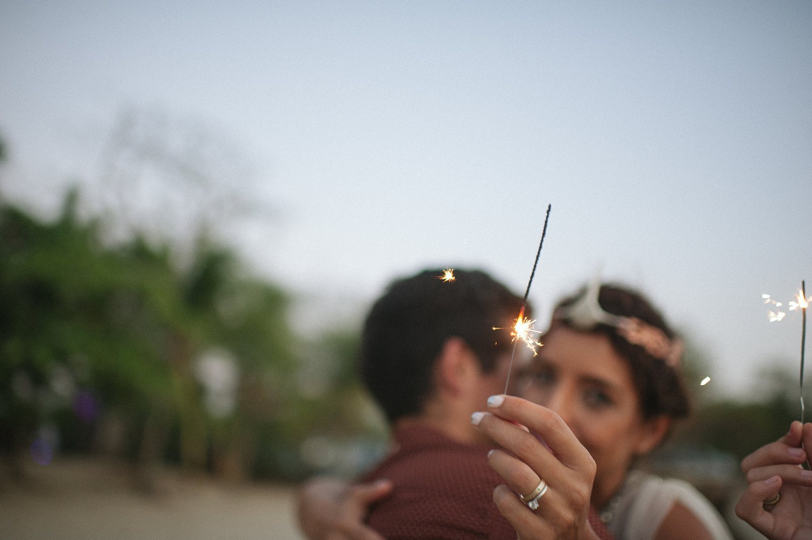 The couple close in a blur of sparklers