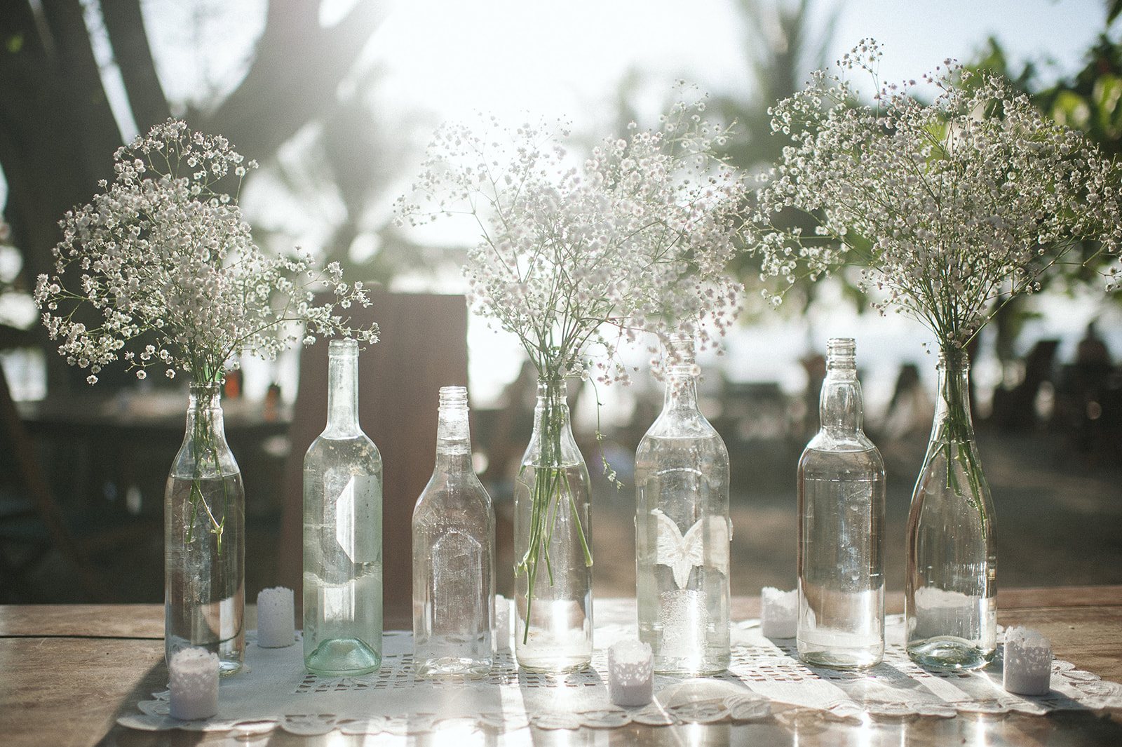 Bottles of baby's breath in the backlight