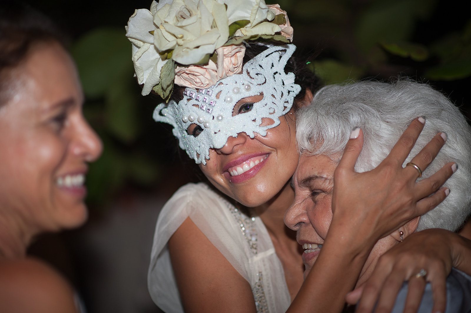 The bride and a friend in lace masks