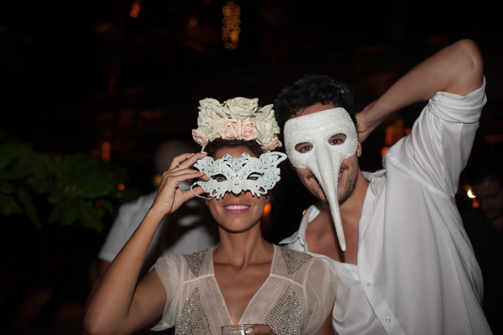Guests in masks at the party