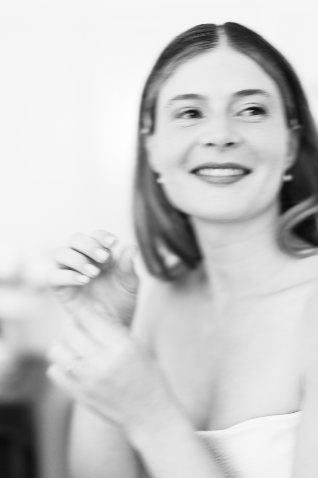 The bride smiling, a close portrait in black and white