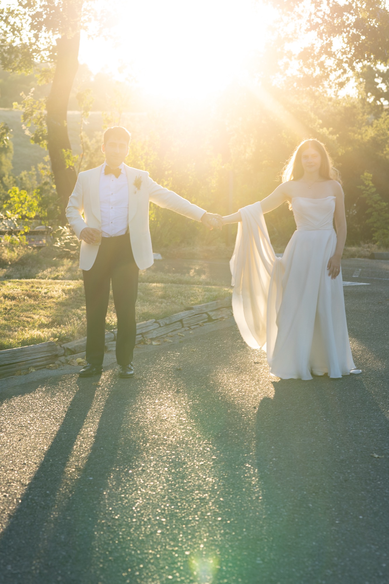 The couple in a burst of sun on the drive