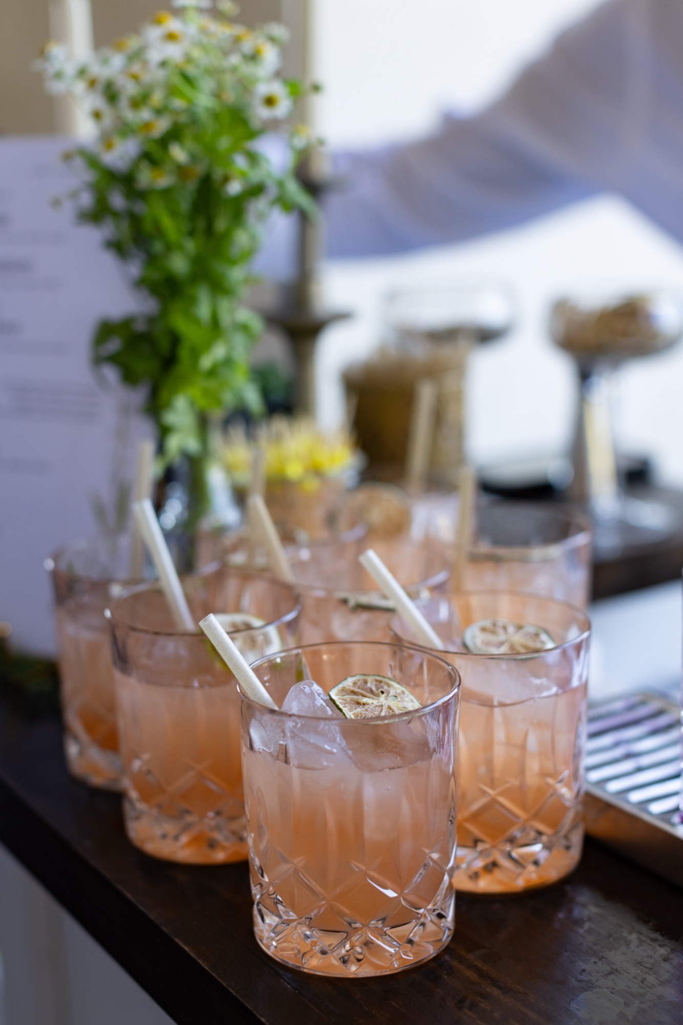 Pink cocktails with flower garnishes