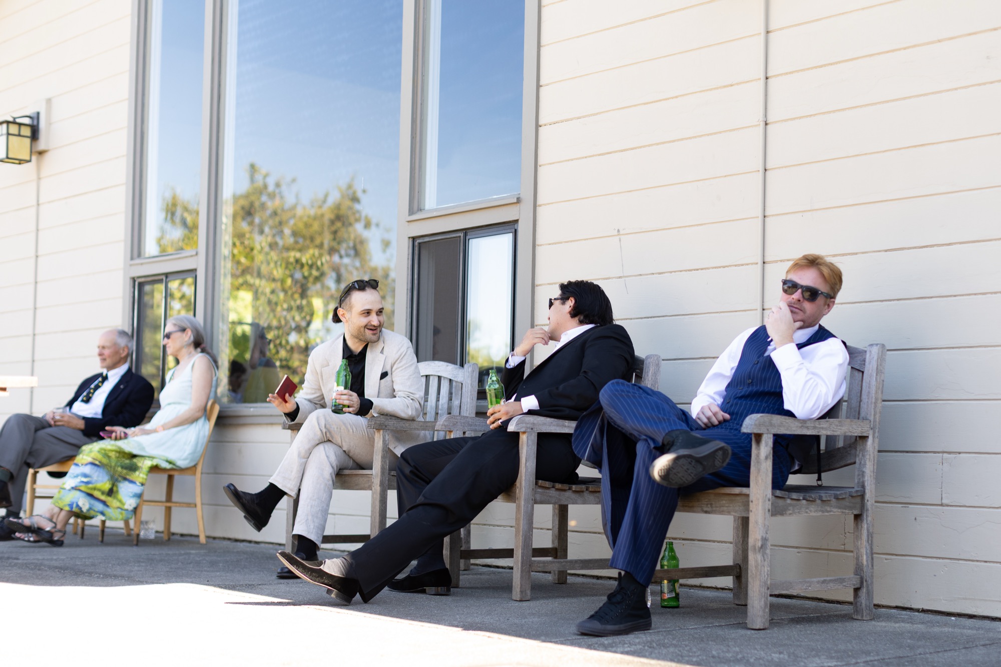 Guests lounging outside the hall in the evening