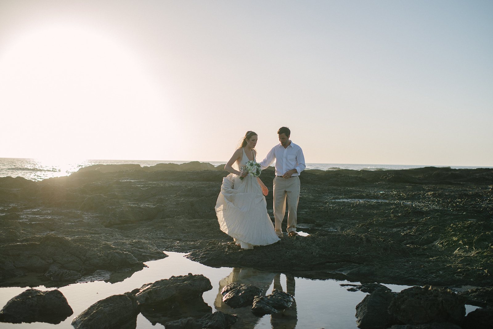 The couple reflected in the tide pools