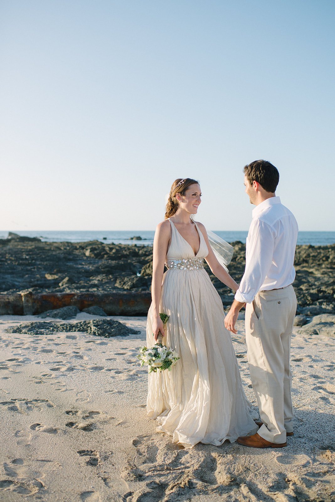 The couple on the rocks at sunset