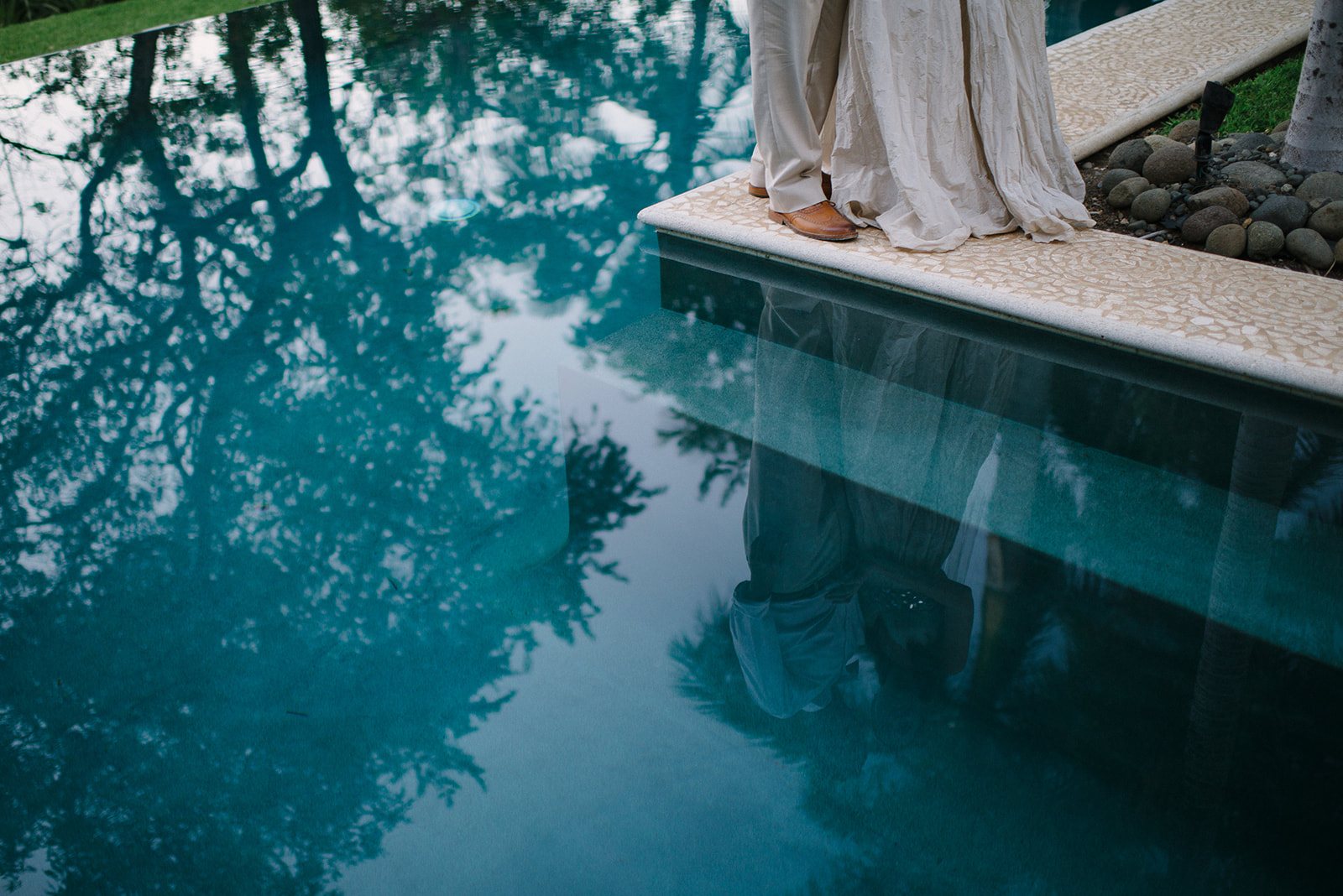 The pool and the hem of the gown