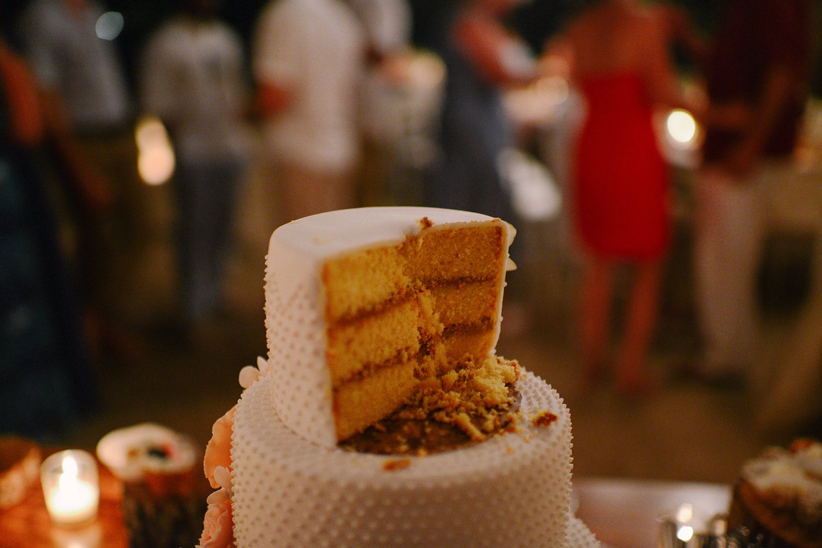 A slice of cake by candlelight
