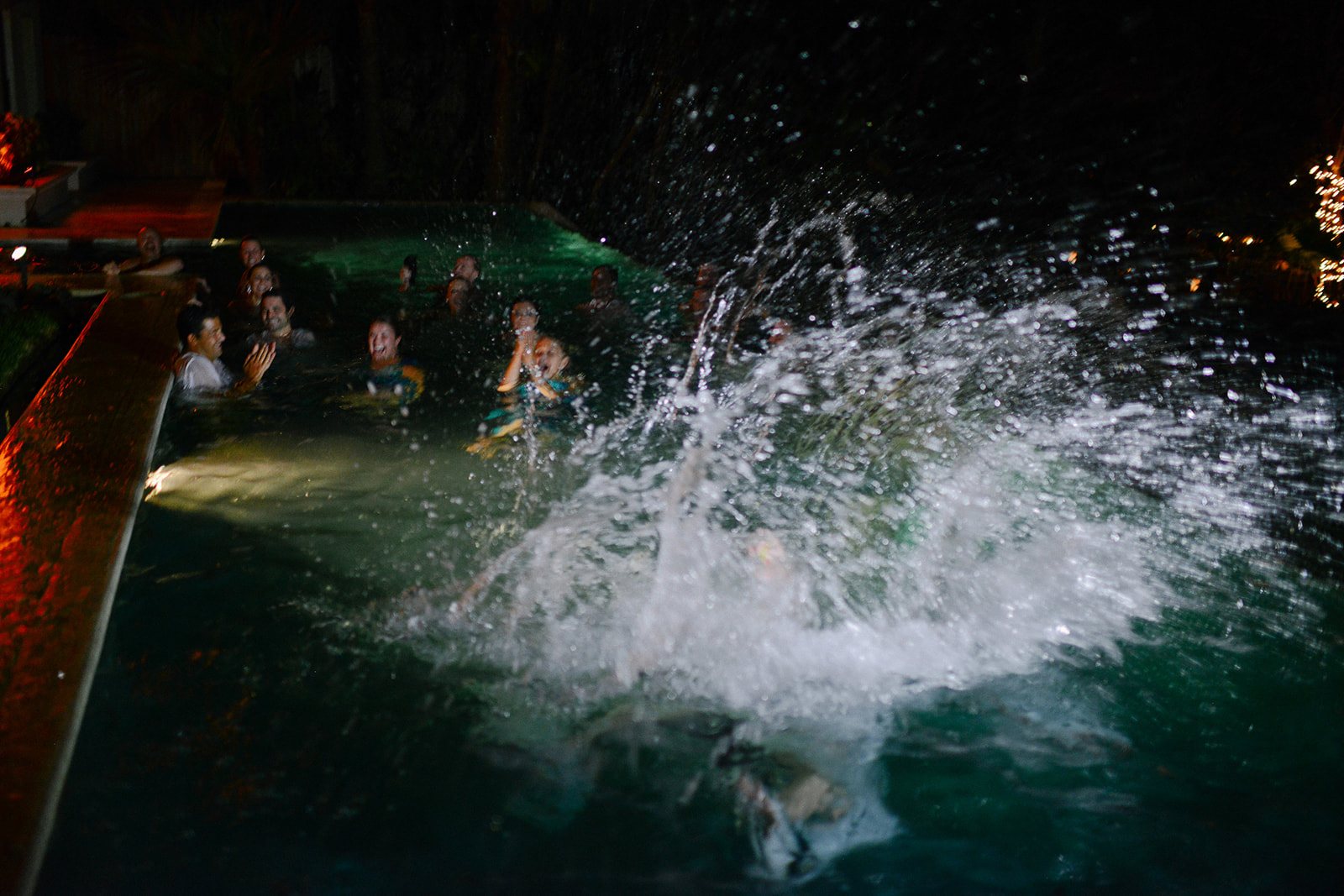 A guest cannonballing into the pool