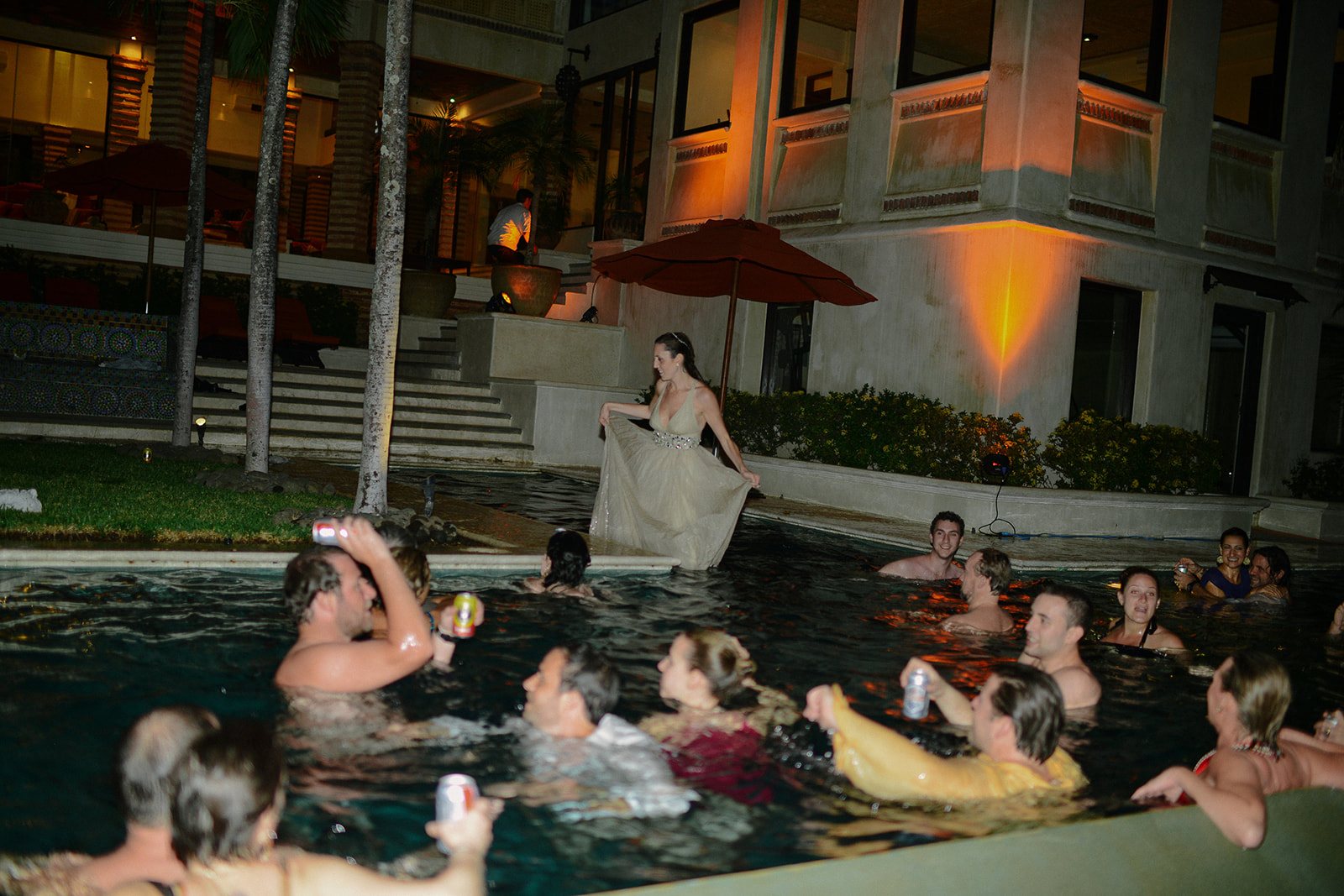 Guests in the pool after dark