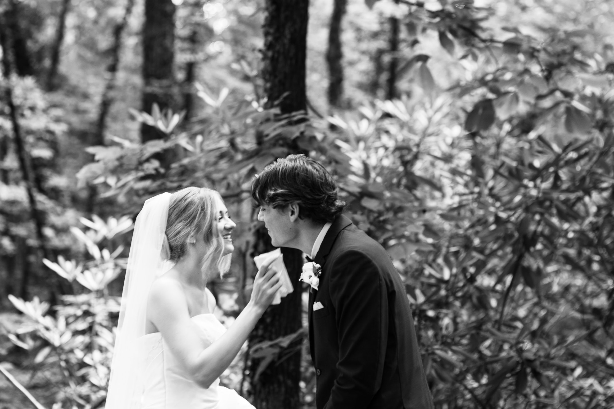 A couple reading letters in black and white