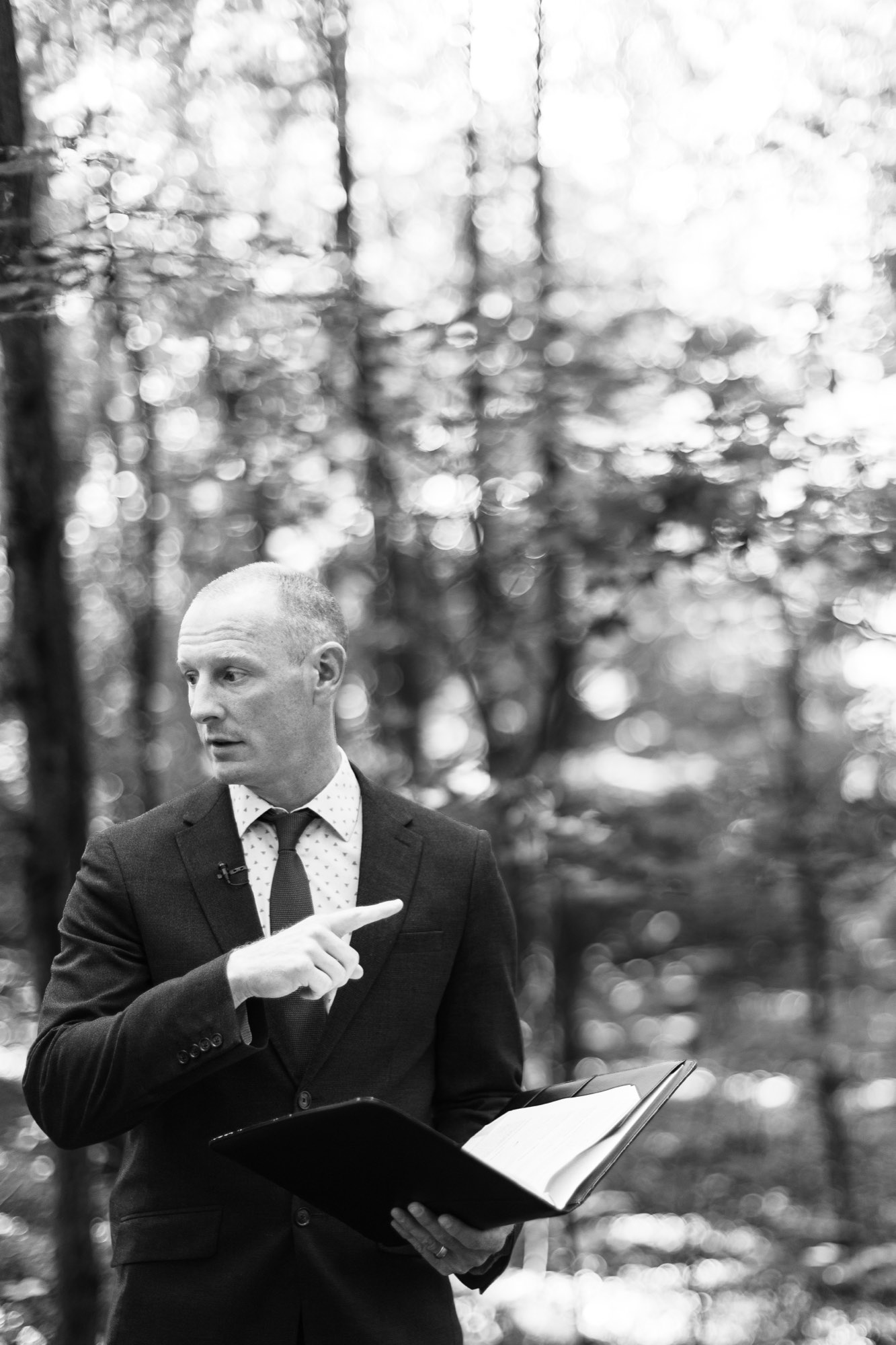 The officiant mid-sentence, in black and white