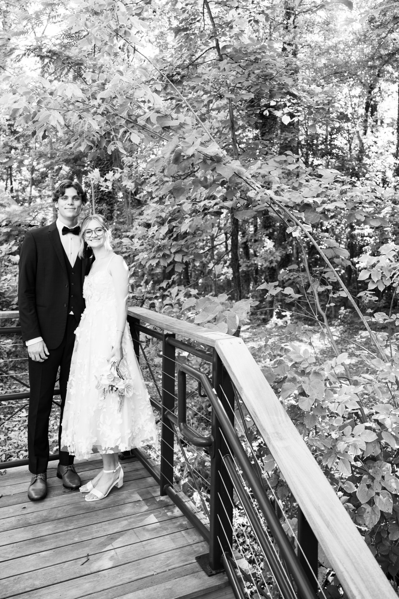 The couple on a wooden bridge, in black and white