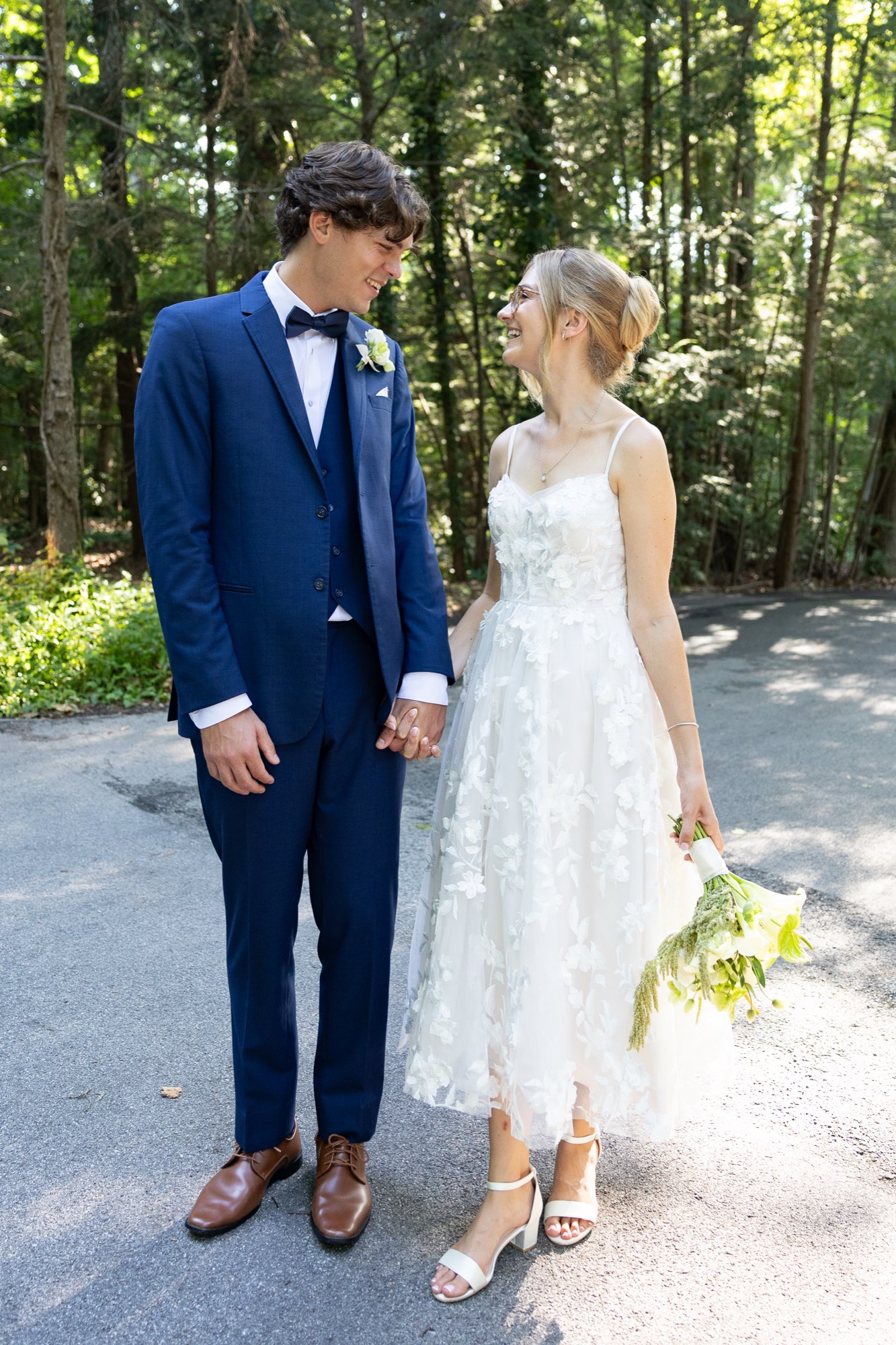 A couple standing in the forest