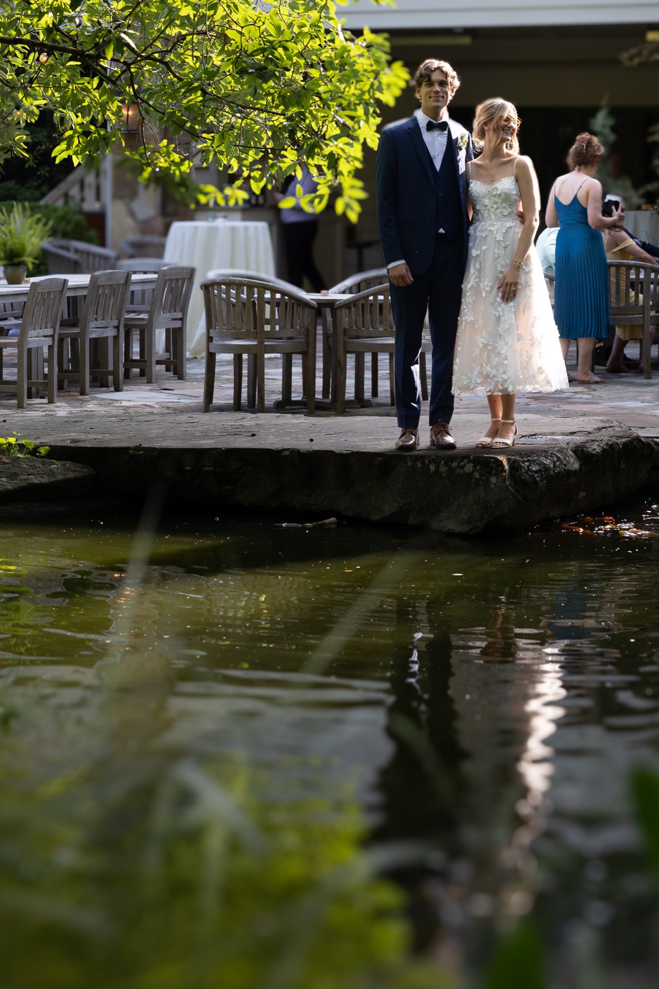 The couple on the deck above the pond