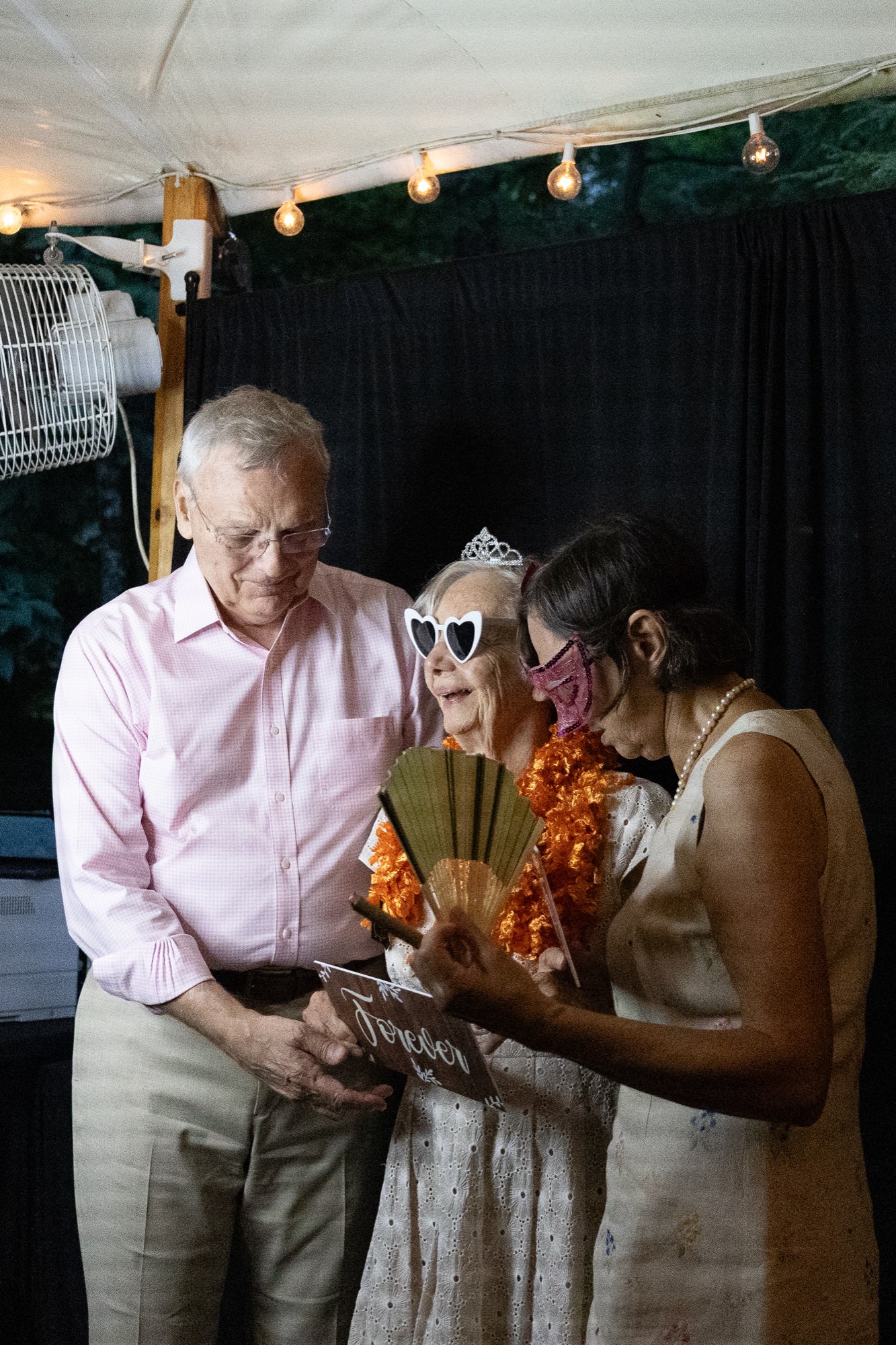 Guests sharing a laugh under the tent