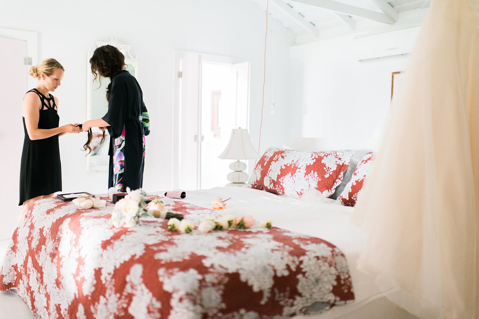 The bride getting ready in a bright bedroom