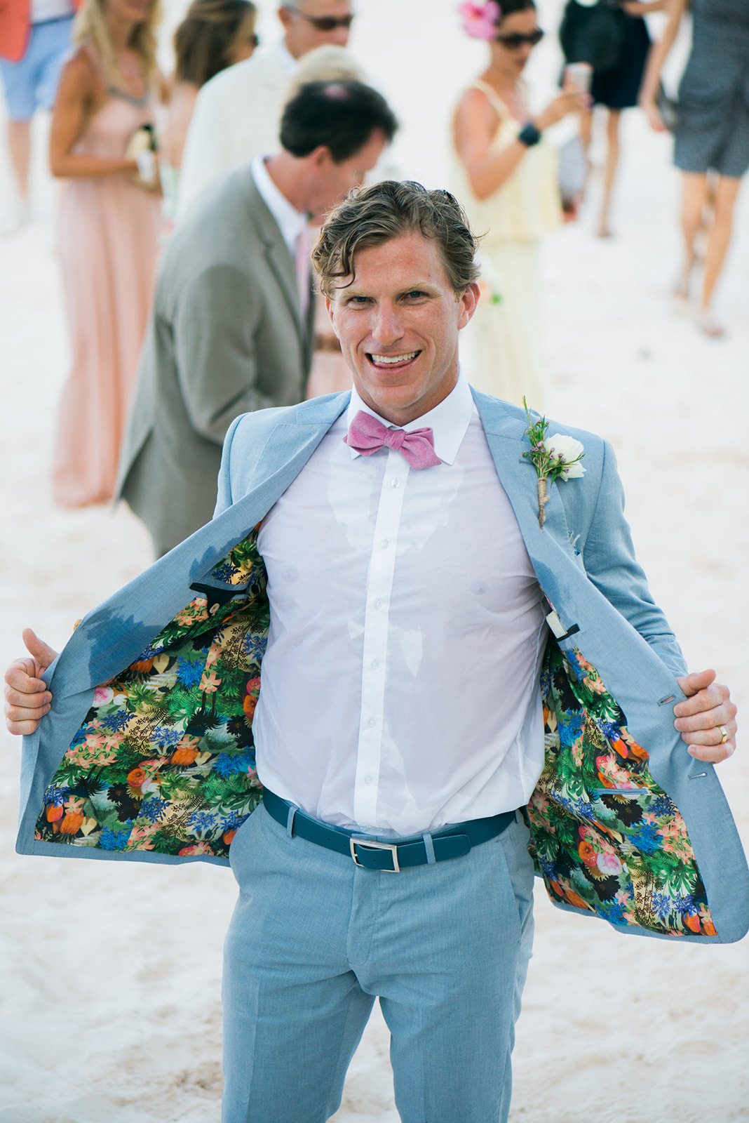 The groom flashing his jacket lining