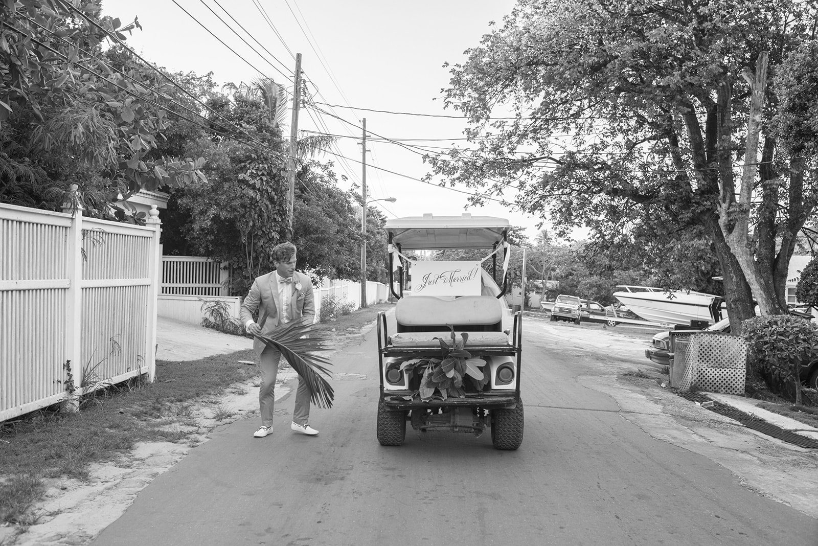 A guest on a golf cart road, in black and white
