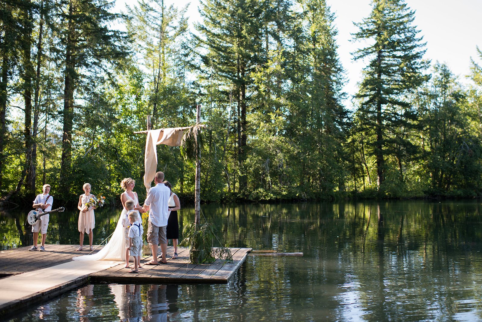 The ceremony on the dock over the lake