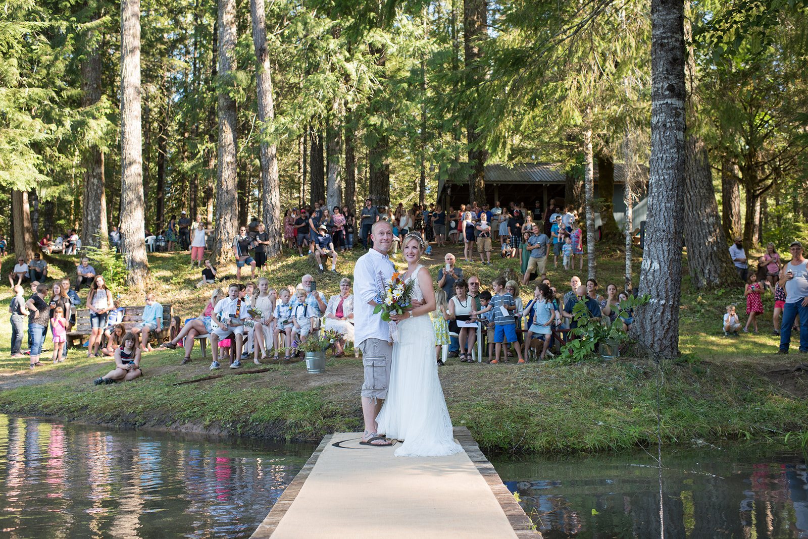 Guests watching from the lakeshore