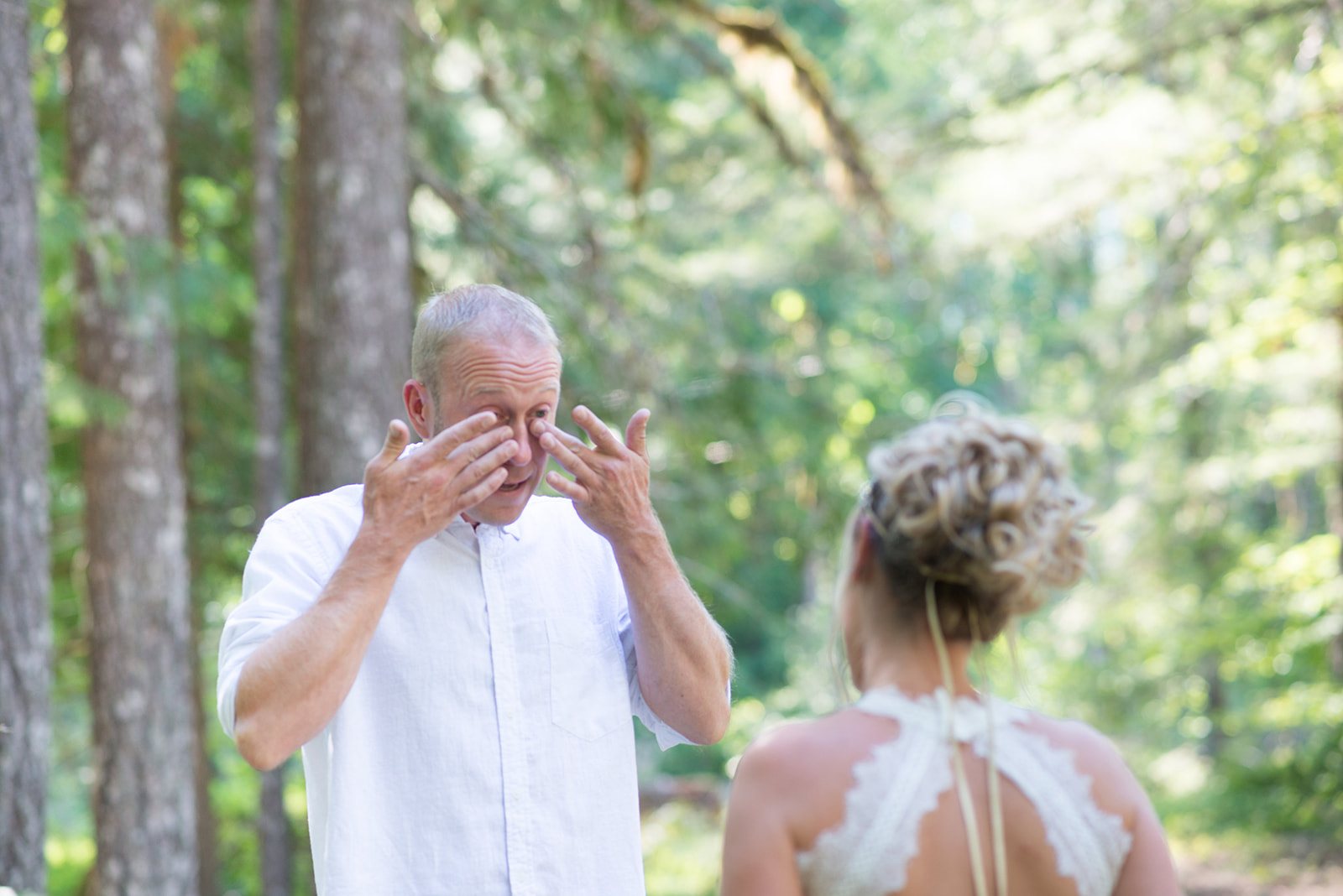 The groom wiping away a tear