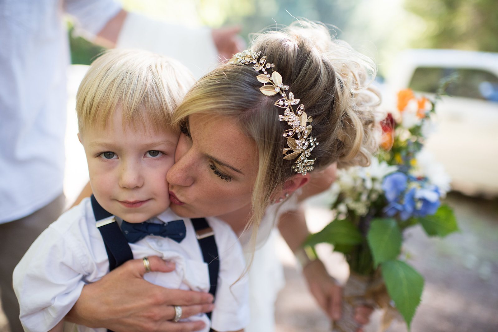 The bride kissing the ring bearer