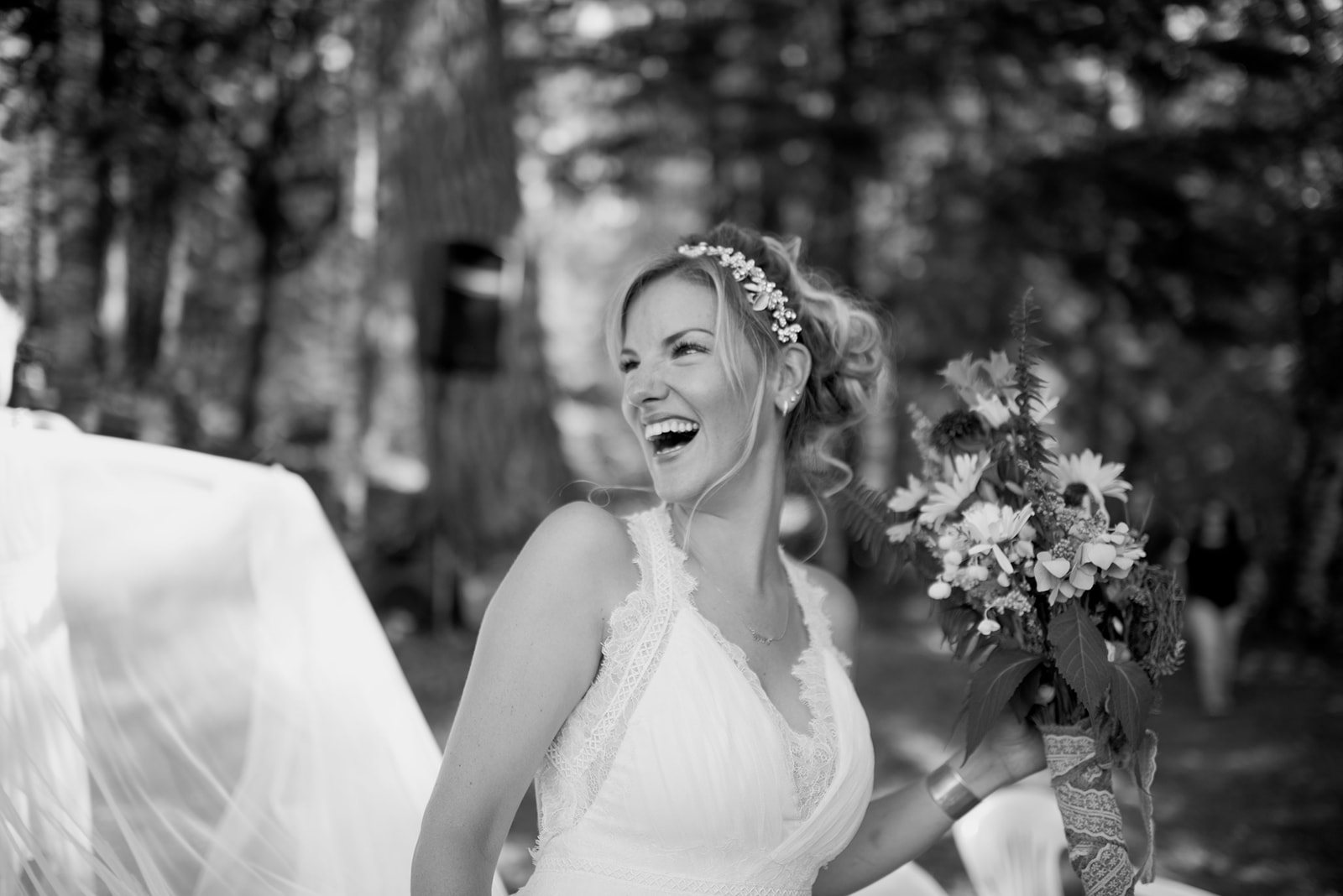 The bride laughing, in black and white