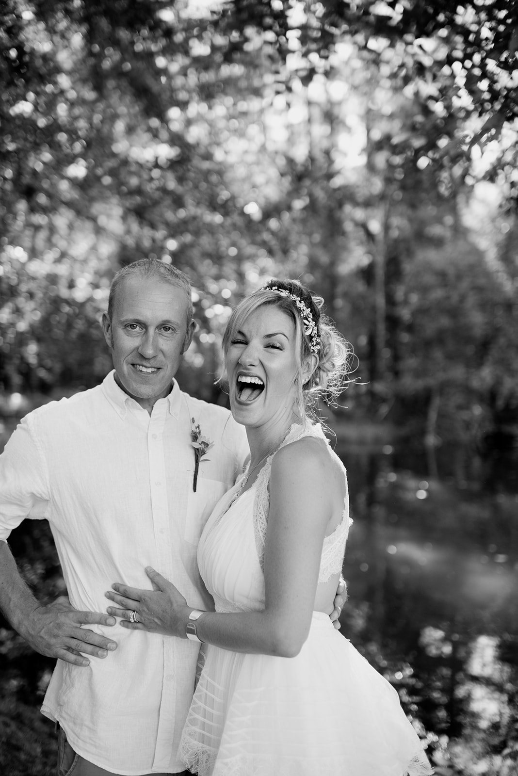 The couple laughing, in black and white