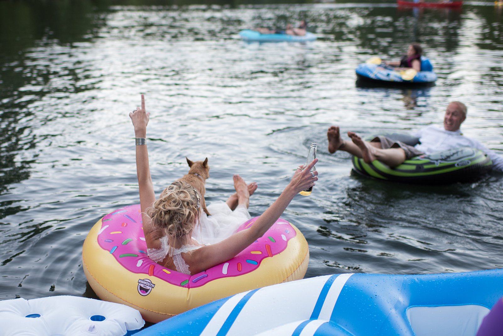 The bride waving from her inner tube