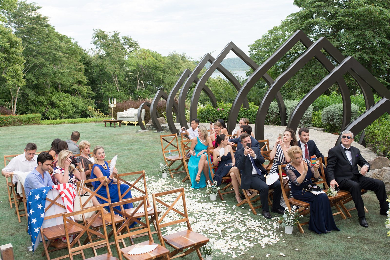 Guests seated beneath the wooden arches